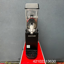 Load image into Gallery viewer, Black Samixir blender on a red platform against a gray wall