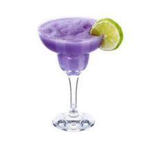 Load image into Gallery viewer, A glass of purple Fruchilla Cocktail Fruit Tingle slushie with a slice of lime on the rim.